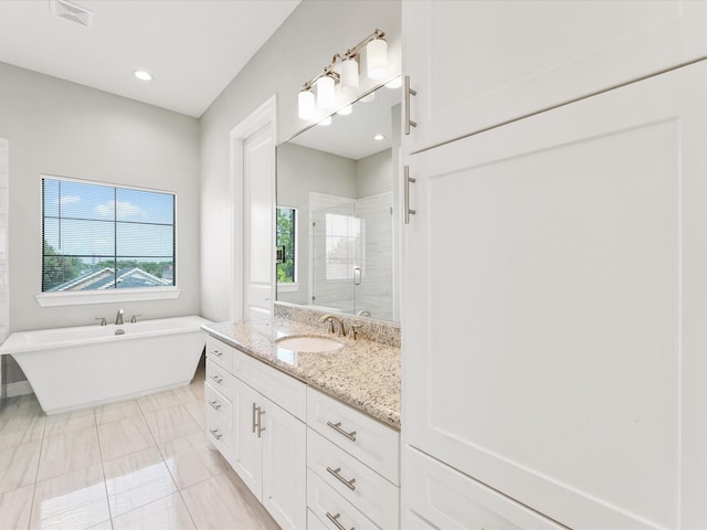 3303 Beverly Forest Dr, Houston, TX 77057 - full bath with a stall shower, vanity, a freestanding bath, and recessed lighting