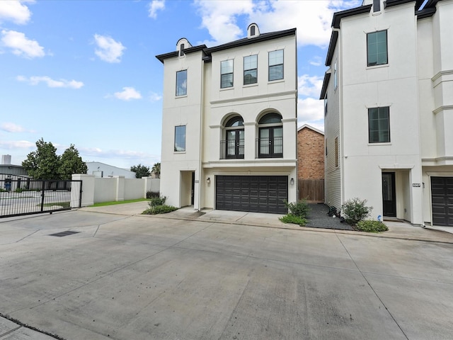 3303 Beverly Forest Dr, Houston, TX 77057 - view of front of house with an attached garage, concrete driveway, and stucco siding