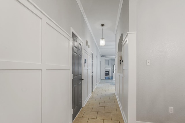 17919 Eagle Pass Falls Ct, Humble, TX 77346 - hallway featuring light tile patterned flooring and ornamental molding