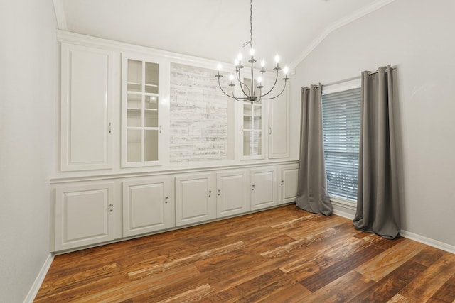 17919 Eagle Pass Falls Ct, Humble, TX 77346 - unfurnished dining area with a chandelier, vaulted ceiling, and dark wood finished floors