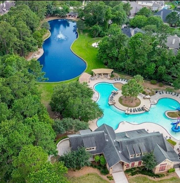 17919 Eagle Pass Falls Ct, Humble, TX 77346 - aerial view of property and surrounding area with a pool area and a large body of water