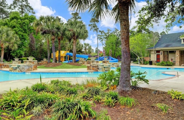17919 Eagle Pass Falls Ct, Humble, TX 77346 - community pool with a water play area and a water slide