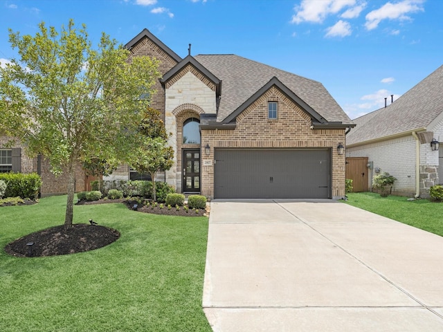 23027 Needlegrass Rd, Katy, TX 77493 - french country inspired facade featuring brick siding, concrete driveway, a garage, a front lawn, and a shingled roof