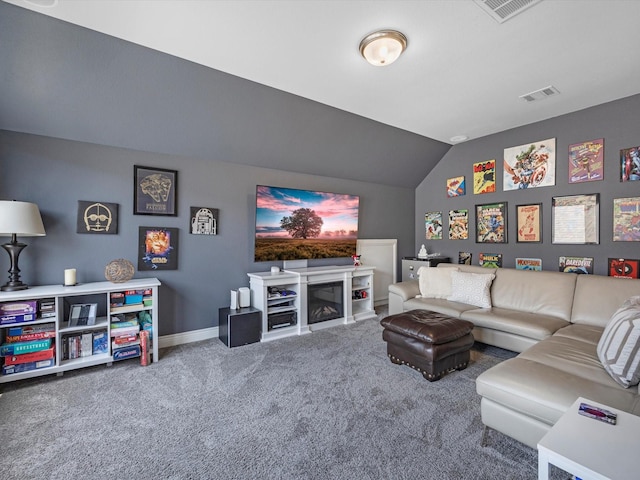 23027 Needlegrass Rd, Katy, TX 77493 - carpeted living area with vaulted ceiling and baseboards