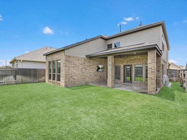 23027 Needlegrass Rd, Katy, TX 77493 - rear view of property featuring brick siding, a fenced backyard, and a patio