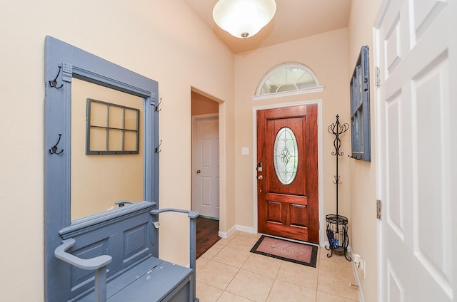 6215 Carnaby Ln, Rosenberg, TX 77471 - entryway with baseboards and light tile patterned flooring