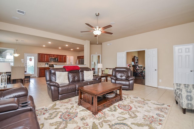 6215 Carnaby Ln, Rosenberg, TX 77471 - living room featuring light tile patterned floors, ceiling fan, and recessed lighting