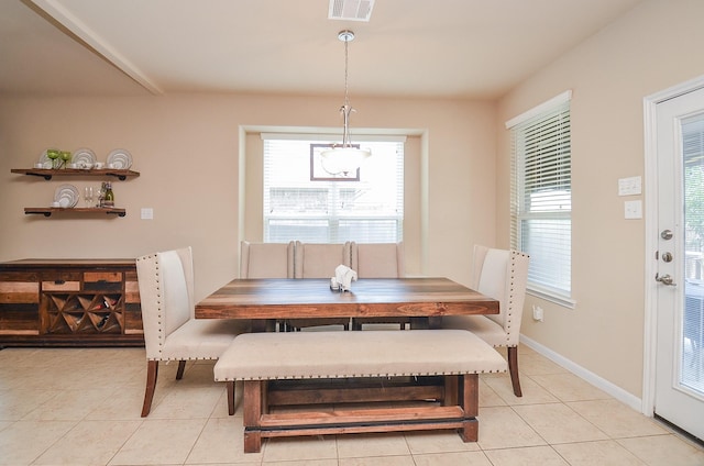6215 Carnaby Ln, Rosenberg, TX 77471 - dining space featuring light tile patterned flooring and baseboards