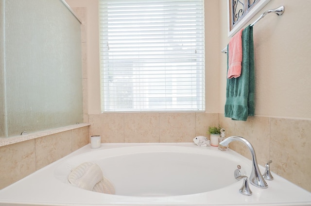 6215 Carnaby Ln, Rosenberg, TX 77471 - full bathroom featuring a garden tub