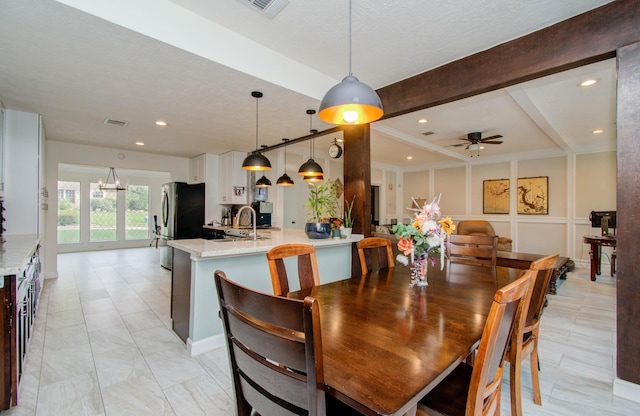 5422 Windy Lake Dr, Houston, TX 77345 - dining area with ceiling fan, beamed ceiling, a decorative wall, and recessed lighting