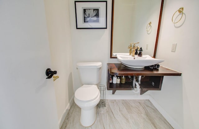 5422 Windy Lake Dr, Houston, TX 77345 - half bathroom featuring toilet and a sink