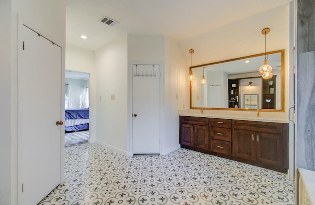 5422 Windy Lake Dr, Houston, TX 77345 - ensuite bathroom featuring double vanity and baseboards