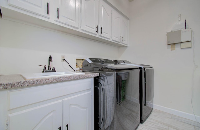 5422 Windy Lake Dr, Houston, TX 77345 - laundry area with washer and clothes dryer and cabinet space