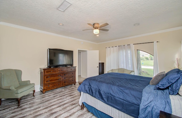 5422 Windy Lake Dr, Houston, TX 77345 - bedroom featuring wood finished floors, crown molding, ceiling fan, and a textured ceiling