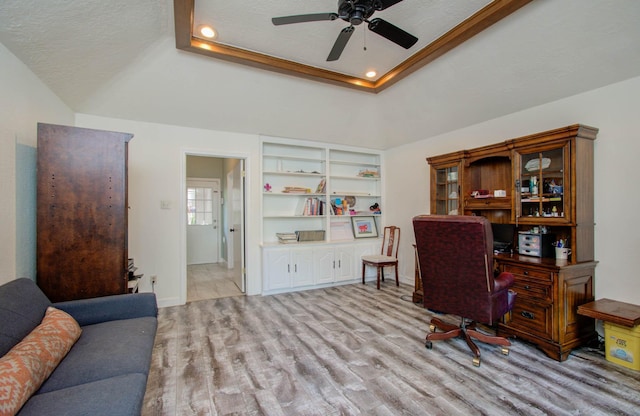 5422 Windy Lake Dr, Houston, TX 77345 - home office with wood finished floors, a ceiling fan, a tray ceiling, recessed lighting, and a textured ceiling