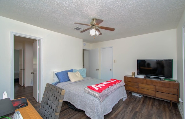 5422 Windy Lake Dr, Houston, TX 77345 - bedroom featuring wood finished floors, a textured ceiling, and ceiling fan