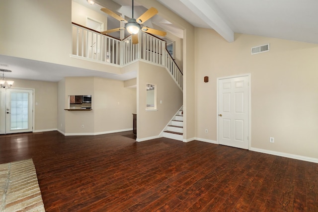 2351 Loyanne Dr, Spring, TX 77373 - unfurnished living room featuring high vaulted ceiling, a ceiling fan, wood finished floors, stairs, and a chandelier