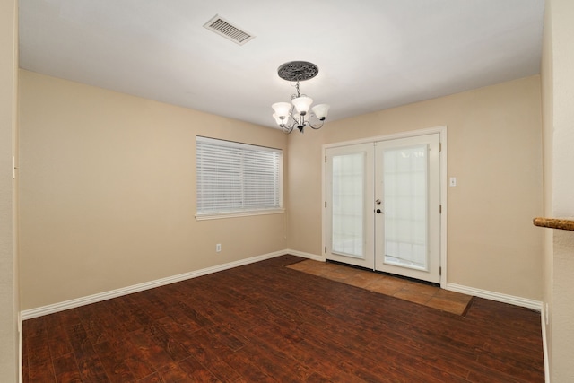 2351 Loyanne Dr, Spring, TX 77373 - unfurnished room featuring a chandelier, wood finished floors, and french doors