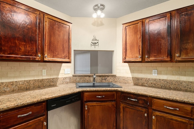 2351 Loyanne Dr, Spring, TX 77373 - kitchen with stainless steel dishwasher, backsplash, and light stone countertops