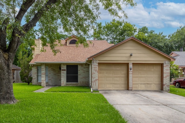 2351 Loyanne Dr, Spring, TX 77373 - view of front of home with a shingled roof, concrete driveway, a chimney, a front lawn, and an attached garage