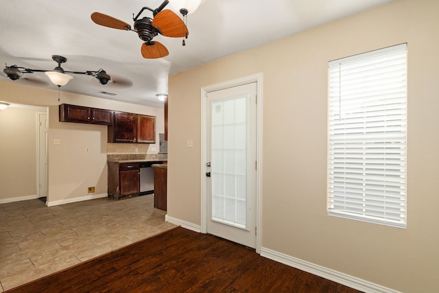 2351 Loyanne Dr, Spring, TX 77373 - kitchen with dark brown cabinetry, wood finished floors, and ceiling fan