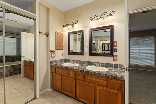 2351 Loyanne Dr, Spring, TX 77373 - full bath featuring double vanity, tile patterned floors, and tiled tub