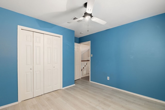 2351 Loyanne Dr, Spring, TX 77373 - unfurnished bedroom featuring a closet, wood finished floors, and ceiling fan