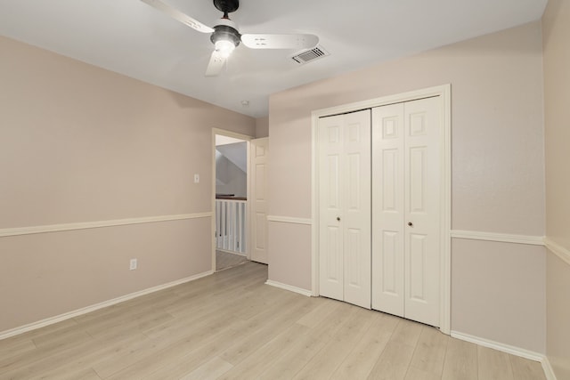 2351 Loyanne Dr, Spring, TX 77373 - unfurnished bedroom featuring light wood-style floors, a closet, and ceiling fan