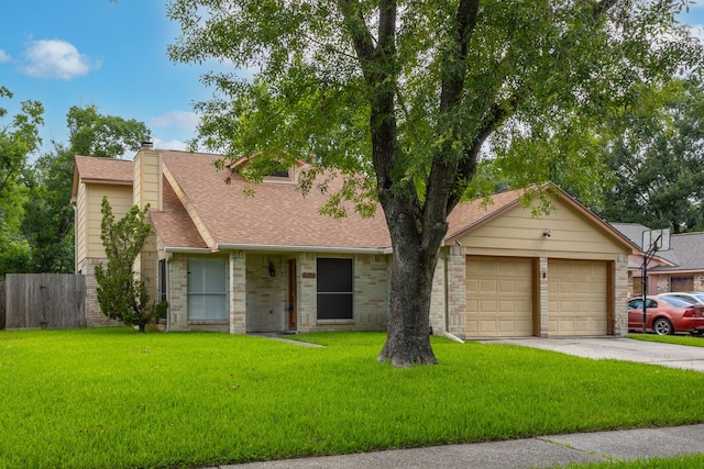 2351 Loyanne Dr, Spring, TX 77373 - view of front of house with a shingled roof, driveway, and a chimney