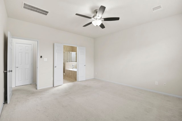 15107 Sequoia Meadow Ct, Humble, TX 77346 - unfurnished bedroom featuring light colored carpet, ensuite bathroom, and a ceiling fan