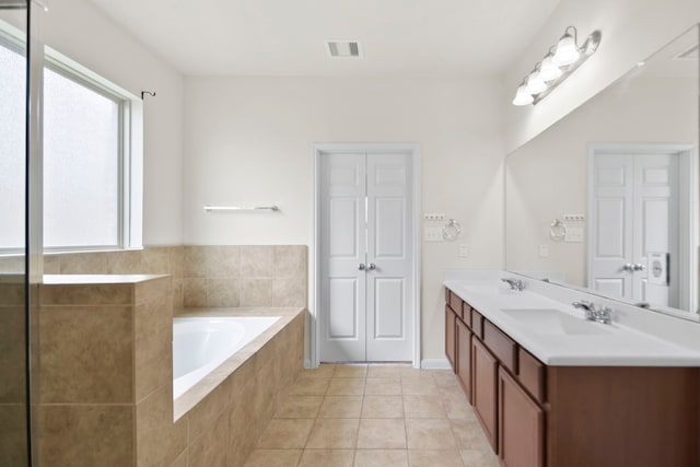 15107 Sequoia Meadow Ct, Humble, TX 77346 - bathroom featuring double vanity, a garden tub, and tile patterned flooring