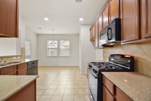 15107 Sequoia Meadow Ct, Humble, TX 77346 - kitchen with black appliances, backsplash, brown cabinetry, recessed lighting, and light stone counters
