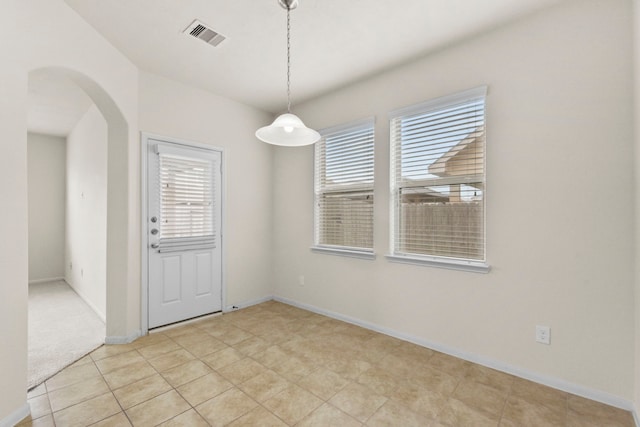15107 Sequoia Meadow Ct, Humble, TX 77346 - unfurnished dining area featuring arched walkways and baseboards