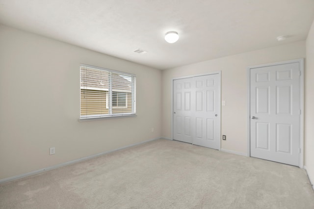 15107 Sequoia Meadow Ct, Humble, TX 77346 - unfurnished bedroom with light carpet and a closet