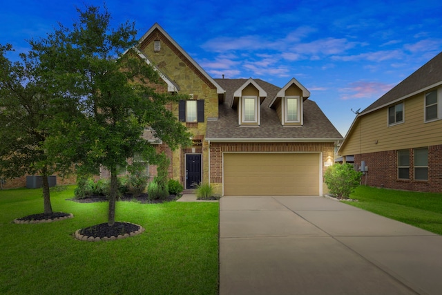 15107 Sequoia Meadow Ct, Humble, TX 77346 - view of front facade with concrete driveway, a front yard, a shingled roof, and brick siding