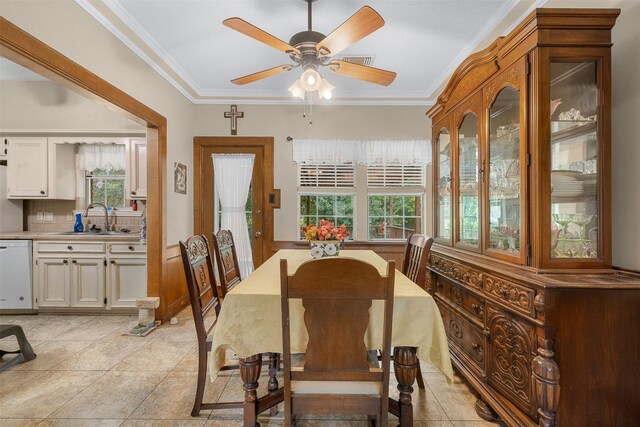 3357 Tamy Ln, Brenham, TX 77833 - dining area with healthy amount of natural light, crown molding, a ceiling fan, and light tile patterned floors