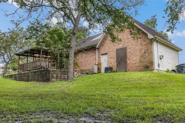 3357 Tamy Ln, Brenham, TX 77833 - view of home's exterior with a yard and brick siding
