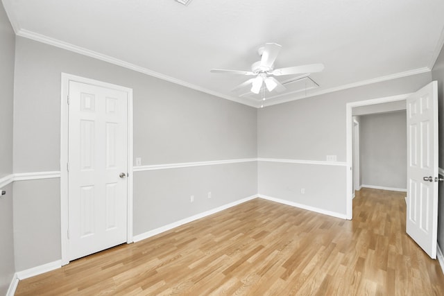 9410 Gatmere Ct, Sugar Land, TX 77498 - empty room featuring a ceiling fan, attic access, light wood-style floors, and ornamental molding