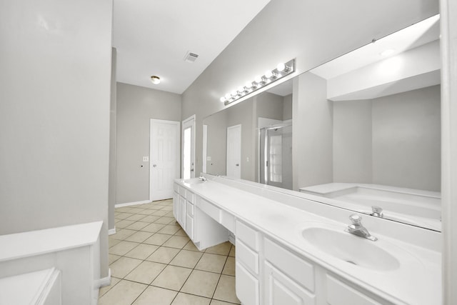 9410 Gatmere Ct, Sugar Land, TX 77498 - full bathroom featuring a stall shower, a garden tub, double vanity, and tile patterned flooring