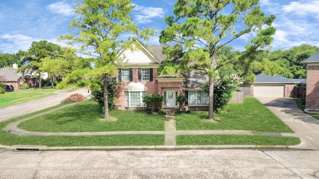 9410 Gatmere Ct, Sugar Land, TX 77498 - view of front facade with a front yard and brick siding