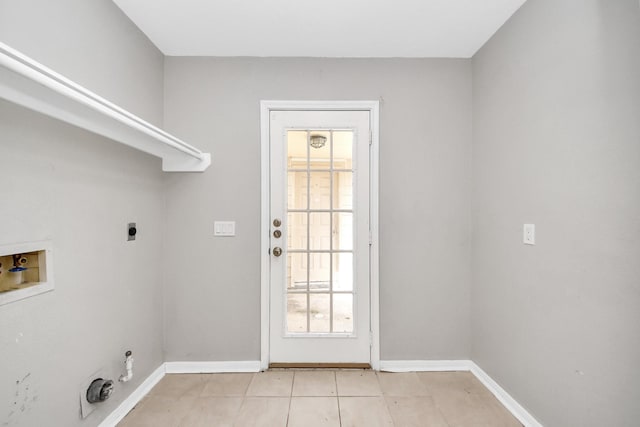 9410 Gatmere Ct, Sugar Land, TX 77498 - laundry area featuring electric dryer hookup, washer hookup, light tile patterned floors, and gas dryer hookup