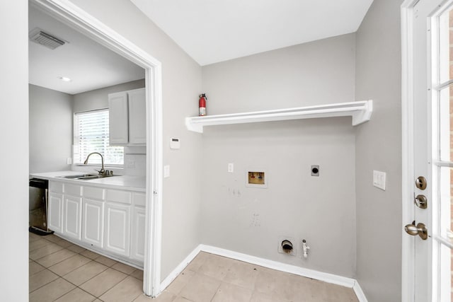 9410 Gatmere Ct, Sugar Land, TX 77498 - laundry room with electric dryer hookup, hookup for a washing machine, light tile patterned flooring, and hookup for a gas dryer