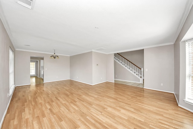 9410 Gatmere Ct, Sugar Land, TX 77498 - unfurnished living room with light wood-style flooring, a chandelier, ornamental molding, and stairs