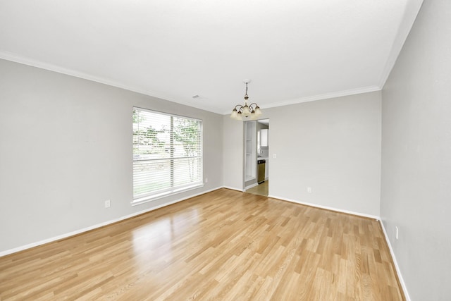 9410 Gatmere Ct, Sugar Land, TX 77498 - empty room with a chandelier, light wood-style floors, and ornamental molding