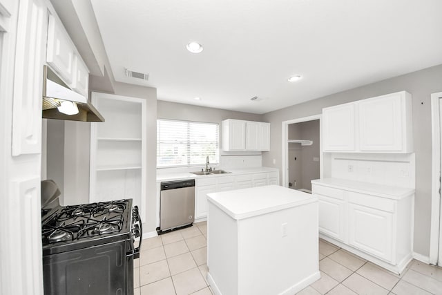 9410 Gatmere Ct, Sugar Land, TX 77498 - kitchen with stainless steel dishwasher, black gas stove, under cabinet range hood, open shelves, and a kitchen island