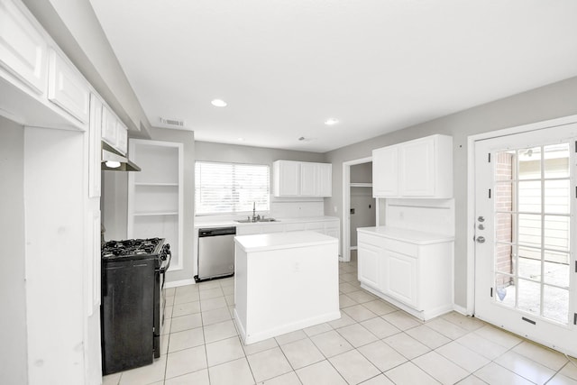 9410 Gatmere Ct, Sugar Land, TX 77498 - kitchen featuring stainless steel dishwasher, gas range, light countertops, a center island, and white cabinets