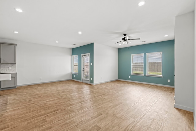 207 William Ln, Rosharon, TX 77583 - unfurnished living room with ceiling fan, recessed lighting, and light wood-style flooring