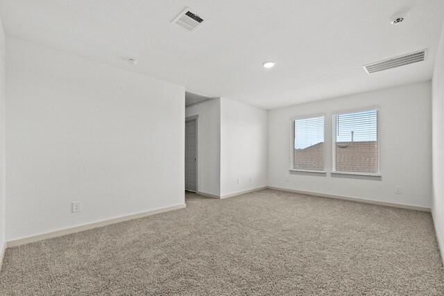 207 William Ln, Rosharon, TX 77583 - spare room featuring light colored carpet and a smoke detector