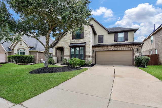 4615 Montcliff Bend Ln, Sugar Land, TX 77479 - french country home with concrete driveway, an attached garage, stone siding, stucco siding, and brick siding