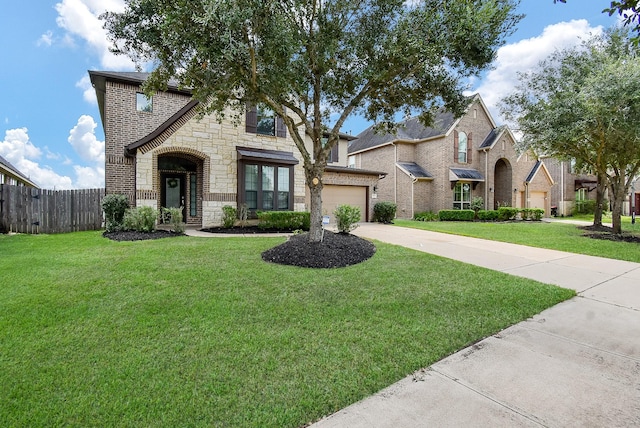 4615 Montcliff Bend Ln, Sugar Land, TX 77479 - view of front of house with stone siding, driveway, and brick siding